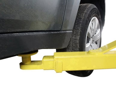Vehicle wheel alignment lift for precise service and maintenance.
