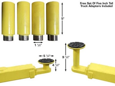 Set of five yellow truck adapters with black rubber tops for lifting and maintenance.